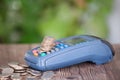 A cash register and a pile of dollar coins on it Royalty Free Stock Photo