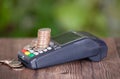 A cash register and a pile of dollar coins on it Royalty Free Stock Photo