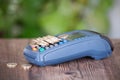 Cash register POS machine and a pile of euro coins on it Royalty Free Stock Photo