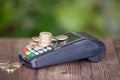 Cash register POS machine and a pile of euro coins on it Royalty Free Stock Photo