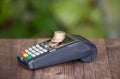 Cash register POS machine and a pile of euro coins on it Royalty Free Stock Photo