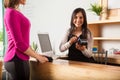 Cash register worker swiping a card Royalty Free Stock Photo