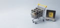 Cash in shopping cart with clocks. Time is money concept Royalty Free Stock Photo