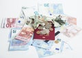 Cash on table isolated: dollars, euro, rubl broken money. All in mess, global crisis . passport travel concept Royalty Free Stock Photo