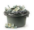 Cash in trash can isolated Royalty Free Stock Photo