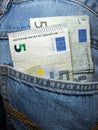 Cash in your pocket. Euro banknotes in blue jeans pocket. Royalty Free Stock Photo