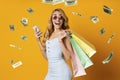 Cashback. Collage Of Woman With Smartphone And Shopping Bags Under Money Shower