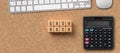 Cashback, discounts and loyalty rewards concept with wooden cubes and letters in a flat lay business still life with calculator Royalty Free Stock Photo