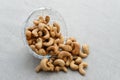 Cashew Nut, in Indonesia known as Kacang Mete. Served in a small bowl on grey background. Royalty Free Stock Photo