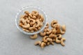 Cashew Nut, in Indonesia known as Kacang Mete. Served in a small bowl on grey background. Royalty Free Stock Photo