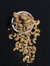 Cashew Nuts, deep fried and in the black background.