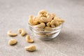 Cashew nuts in the glass bowl on stone table