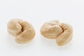 Cashew nuts heap peeled on a white background