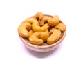 Cashew nuts or kaju isolated on white background. Cashews are commonly used in Indian cuisine, whole for garnishing curry.