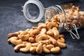 Cashew nuts in an open glass jar on black table ,close-up Royalty Free Stock Photo