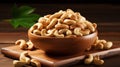 cashew nuts peeled roasted in wooden bowl on rustic table, top view. Royalty Free Stock Photo