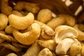 Cashew nuts scattered surface texture. Close up