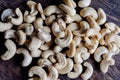 Cashew nuts on wood background directly from above