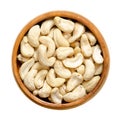 Cashew nuts, raw cashews, seeds of shelled fruits, in a wooden bowl