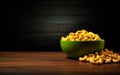cashews in yellow bowl on wooden surface and black wall generative AI