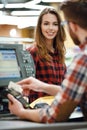 Cashier man on workspace in supermarket shop create payment Royalty Free Stock Photo