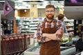 Cashier man on workspace in supermarket shop Royalty Free Stock Photo