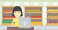 Cashier standing at the checkout in supermarket. Royalty Free Stock Photo