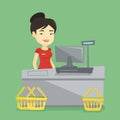 Cashier standing at the checkout in supermarket. Royalty Free Stock Photo