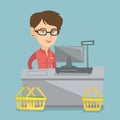 Cashier standing at the checkout in a supermarket. Royalty Free Stock Photo