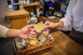 Cashier taking card while customer paying for order by card Royalty Free Stock Photo