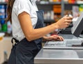 Cashier Using Point of Sale System at Checkout Counter Royalty Free Stock Photo