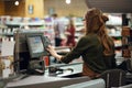 Cashier woman on workspace in supermarket shop Royalty Free Stock Photo