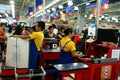 Cashiers and bagger boys in a grocery store in the philippines Royalty Free Stock Photo