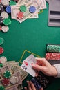 Casino background, two aces cards with a player and dollars and chips on the poker table. Gaming business, success. With space for Royalty Free Stock Photo