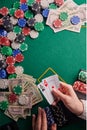 Casino background, two aces cards with a player and dollars and chips on the poker table. Gaming business, success. With space for Royalty Free Stock Photo