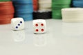 Casino chips and dice on a gray table, selective focus Royalty Free Stock Photo