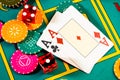 Casino chips with dice and playing cards on game table. Concept of gambling or poker and entertainment. Two aces on the Royalty Free Stock Photo