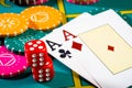 Casino chips with dice and playing cards on game table. Concept of gambling or poker and entertainment. Two aces on the Royalty Free Stock Photo