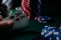 Casino chips and pair of aces on the green table. Poker game Royalty Free Stock Photo