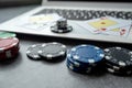 casino chips and playing cards on laptop notebook. Poker game online concept Royalty Free Stock Photo