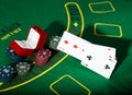 Casino chips and a precious ring on green poker table background, man throws cards with losing combination. Royalty Free Stock Photo