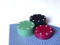 Casino chips / tokens and cards on white background Royalty Free Stock Photo