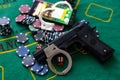 Casino chips a winning combination of cards flush royal next to the police handcuffs Royalty Free Stock Photo