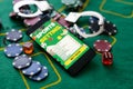 Casino chips a winning combination of cards flush royal next to the police handcuffs Royalty Free Stock Photo