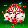 Casino concept with red wheel of fortune, playing cards, dices and flying chips on a green background Royalty Free Stock Photo