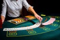 Casino: Dealer shuffles the poker cards Royalty Free Stock Photo