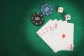 Casino elements-dice, chips, cards-a combination of Royal flush on a green felt table Royalty Free Stock Photo