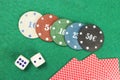 Casino elements-dice, chips, cards-a combination of Royal flush on a green felt table Royalty Free Stock Photo