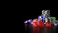 Casino gambling chips and dice on black background. Royalty Free Stock Photo