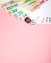 Casino, gambling and fortune concept. Game bones and cards and euro money on pink background with copy space Royalty Free Stock Photo